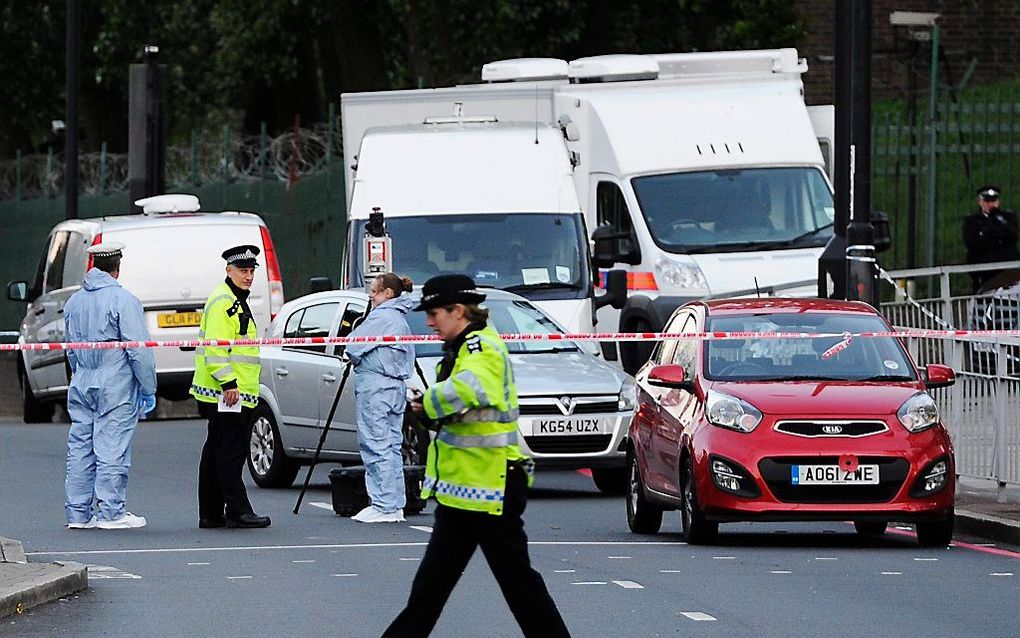 Politie onderzoekt de plek van de moord. Foto EPA