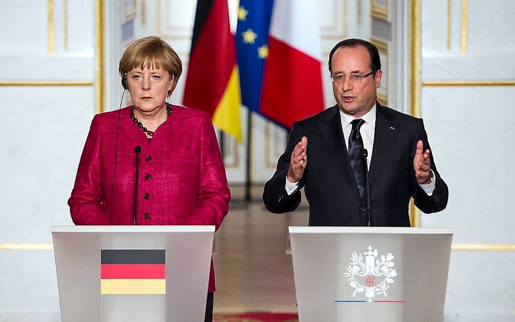 Hollande en Merkel geven een persconferentie na hun ontmoeting donderdag. Foto EPA