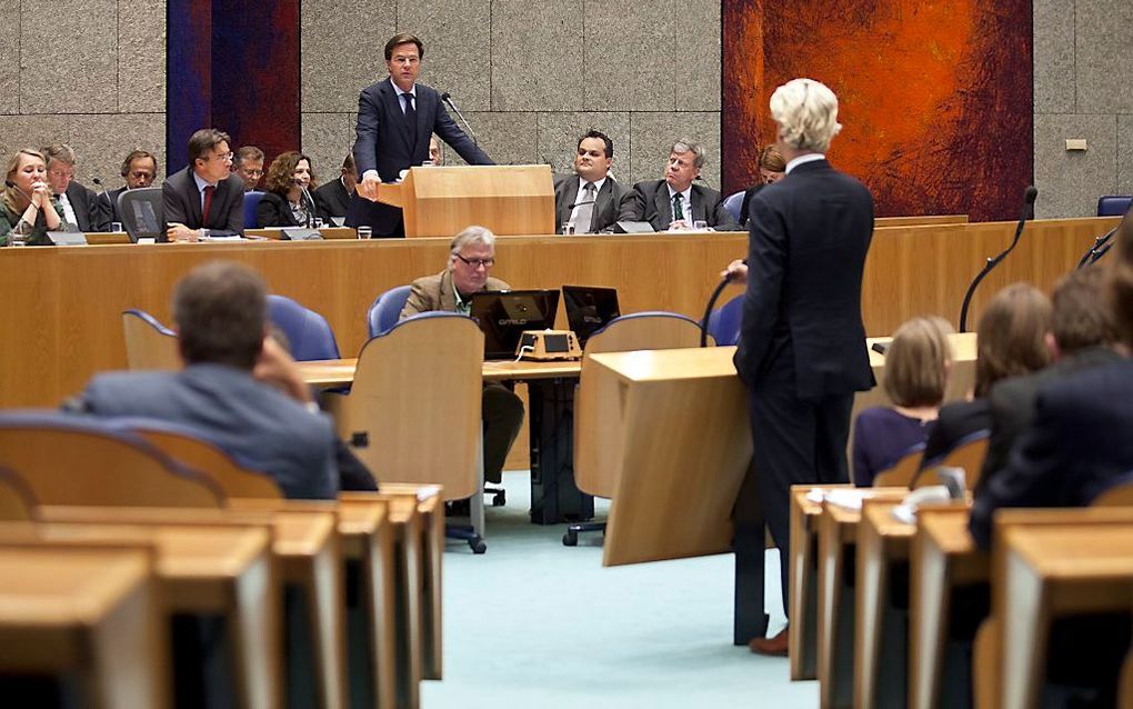 PVV-fractievoorzitter Geert Wilders en premier Mark Rutte net na het moment dat Wilders tegen Rutte doe eens normaal man zei waarop Rutte antwoordde met: doe zelf normaal tijdens de tweede dag van de Algemene Beschouwingen in de Tweede Kamer. Beeld ANP