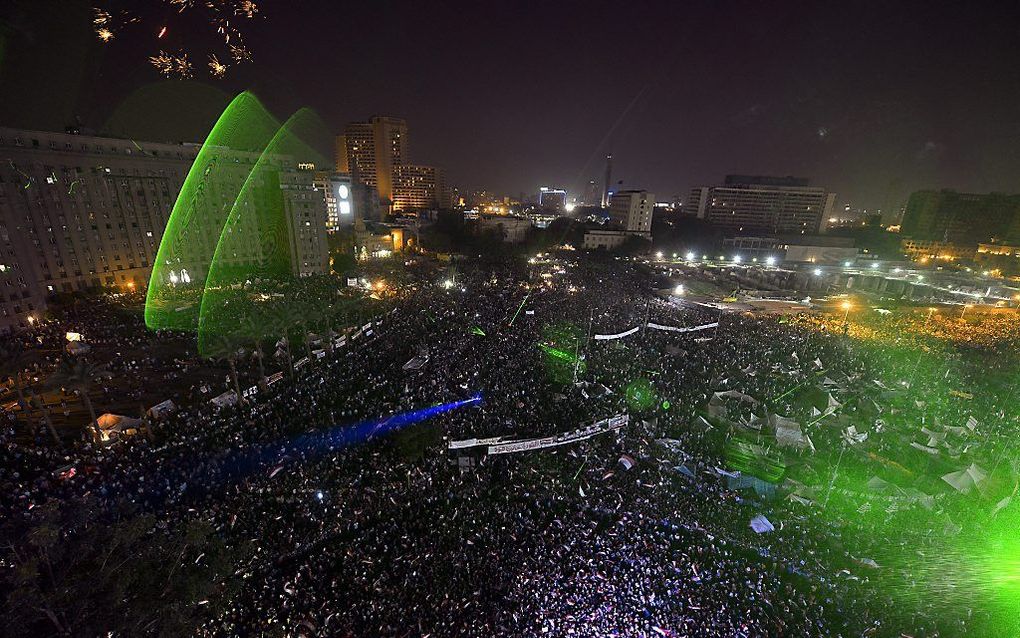 Laserpennetjes op Tahrirplein. Beeld EPA