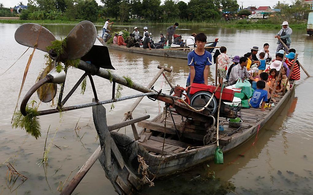 Cambodjanen in de Mekongrivier. Foto EPA