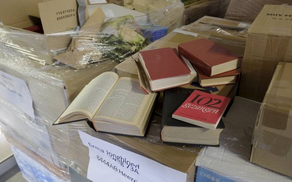 De Bijbelrecycleactie van vorig jaar leverde 41 pallets aan Bijbels, psalmboeken en andere dundrukexemplaren op. De oogst wordt vermalen tot papierpulp en gebruikt voor het produceren van nieuwe Bijbels. Beeld Sjaak Verboom