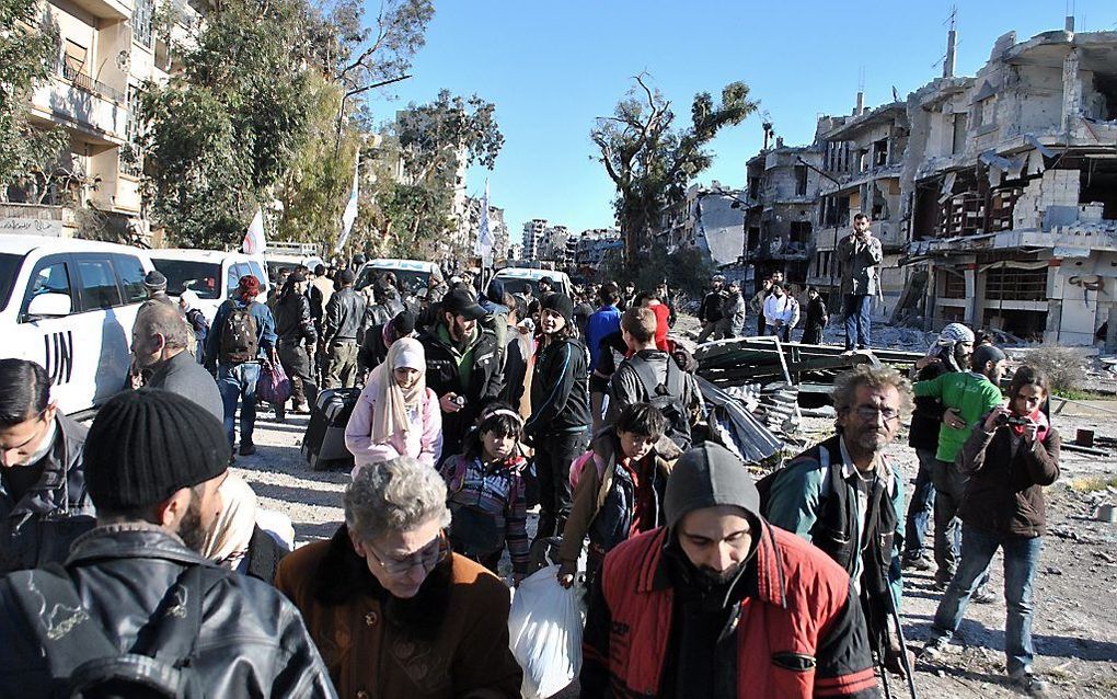 Evacués in Homs. Foto AFP