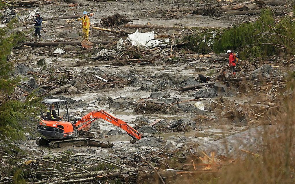 Reddingswerkers zoeken naar overlevenden bij Oso. Foto EPA