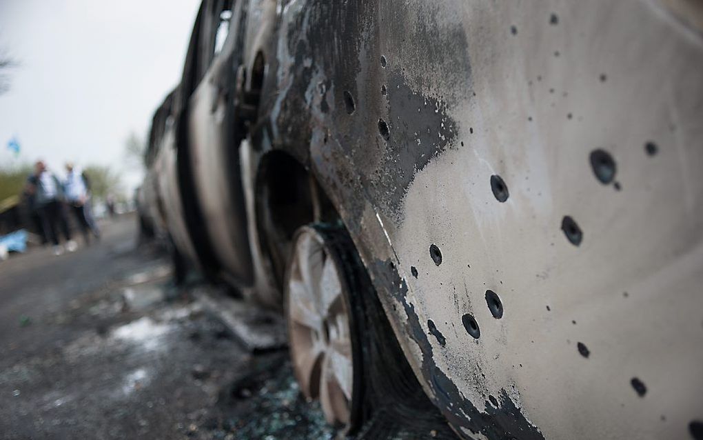 Uitgebrande auto's in Slavjansk. Foto EPA