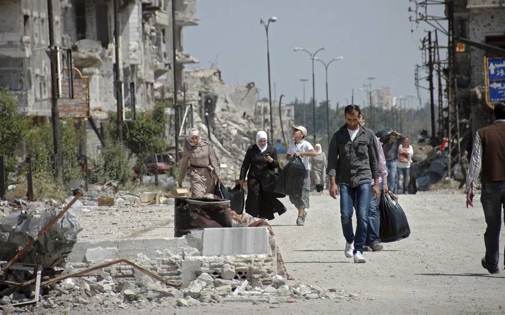 HOMS. Iran lijkt bij de evacuatie van burgers en strijders uit Homs een belangrijke rol te hebben gespeeld. beeld EPA