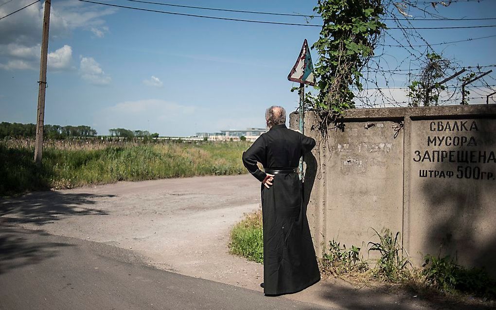 Een priester in Donetsk. Foto EPA