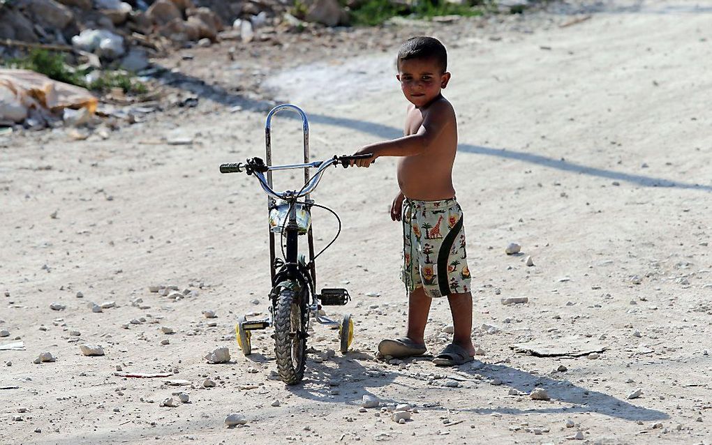 Een jongentje uit Syrië in een vluchtelingenkamp in Libanon. Foto AFP