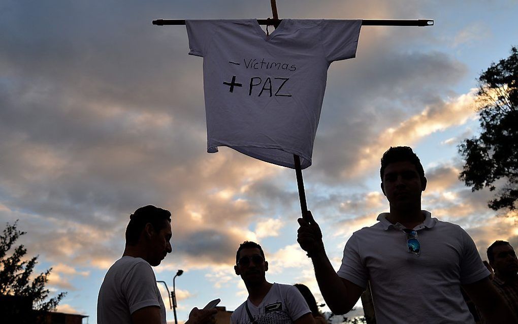 BOGOTA. Aanhangers van de Colombiaanse president betuigden deze week hun steun aan het staatshoofd dat zondag hoopt te worden herkozen. Beeld AFP