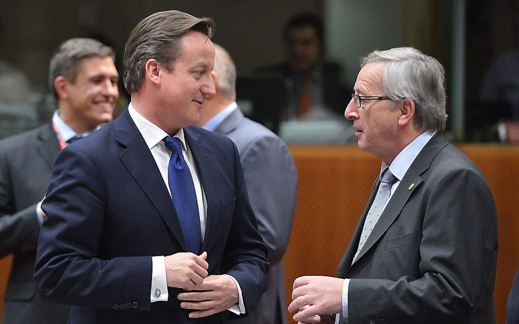 Premier Cameron (l.) kan zijn verzet tegen de Luxemburgse kandidaat Juncker beter opgeven. Foto AFP