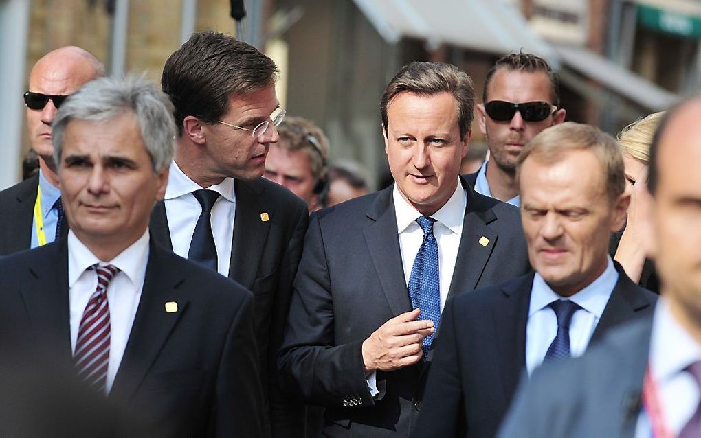 Premier Rutte en zijn Britse ambtsgenoot Cameron donderdag in het Belgische Ieper. beeld AFP