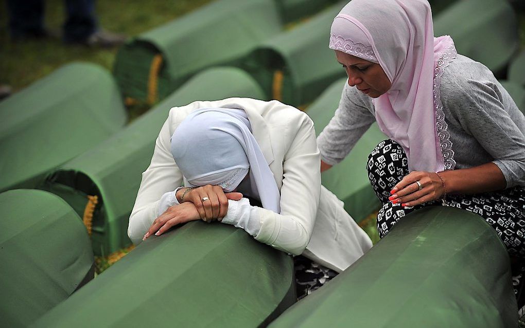 Rouwende vrouwen tijdens een begrafenis. Beeld AFP