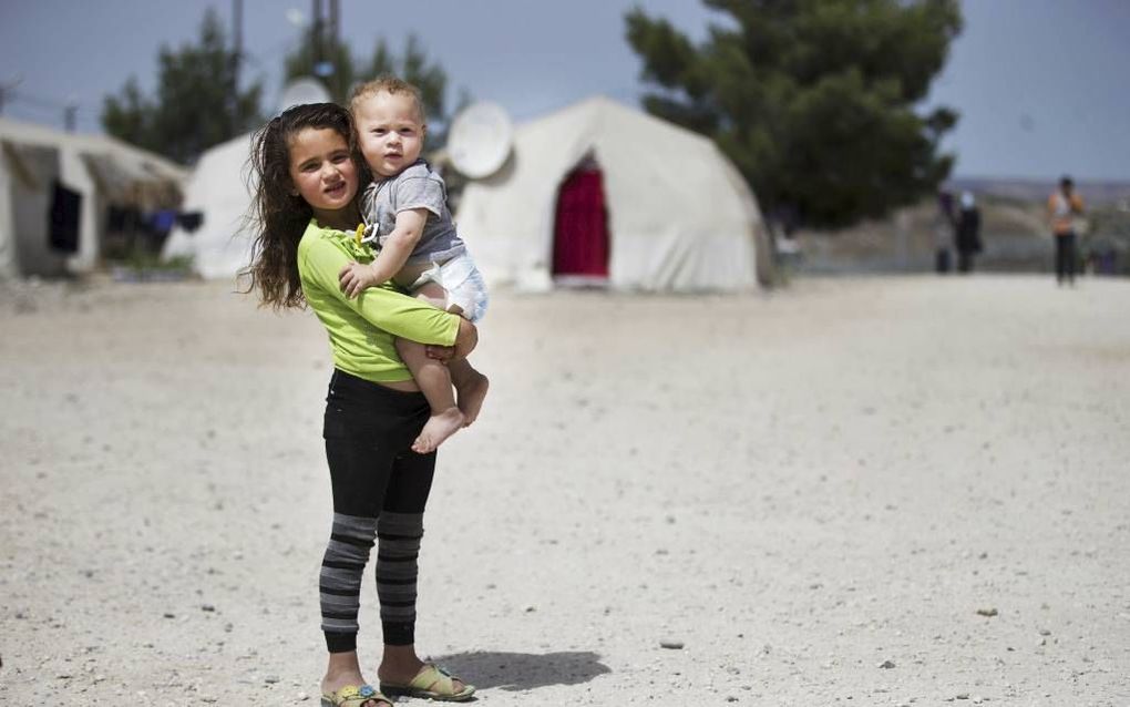 Syrische vluchtelingen in een Libanees tentenkamp. Foto ANP