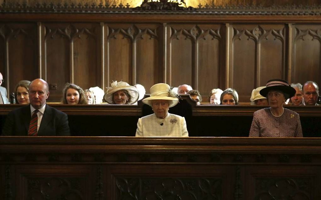 CRATHIE. De Britse koningin Elizabeth (m.) woonde maandag in de kerk van het Schotse Crathie een dienst bij ter herdenking van het begin van de Eerste Wereldoorlog, honderd jaar geleden.   beeld AFP