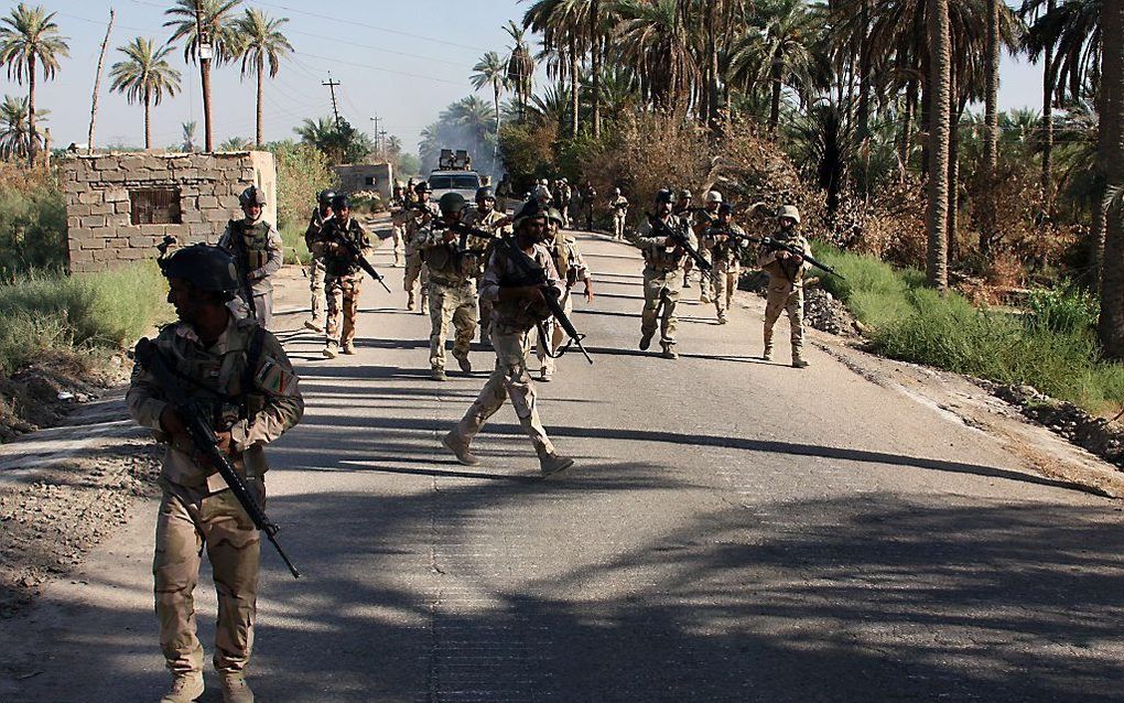 Iraakse militairen in de christelijke plaats Jurf al-Sakhr, 45 kilometer van Bagdad. beeld AFP