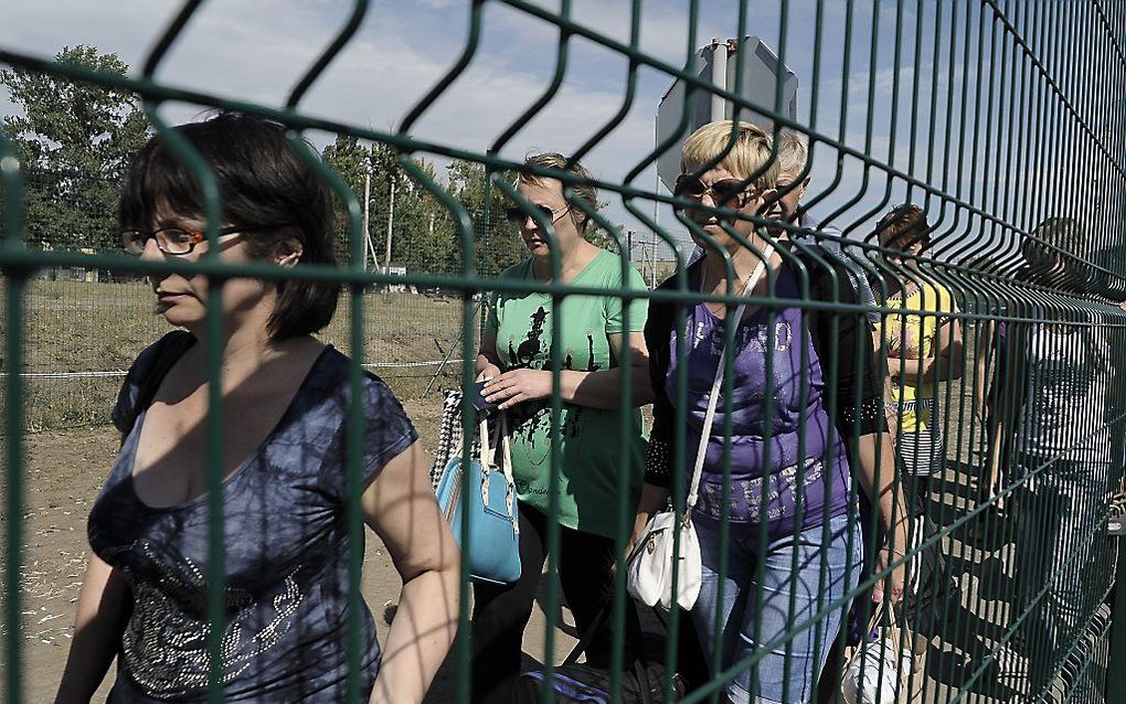 Mensen op de vlucht bij de grens van Oekraine met Rusland. Beeld AFP