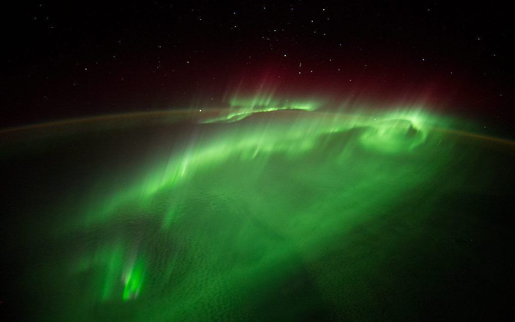 Het noorderlicht vanuit de ruimte gezien. beeld EPA