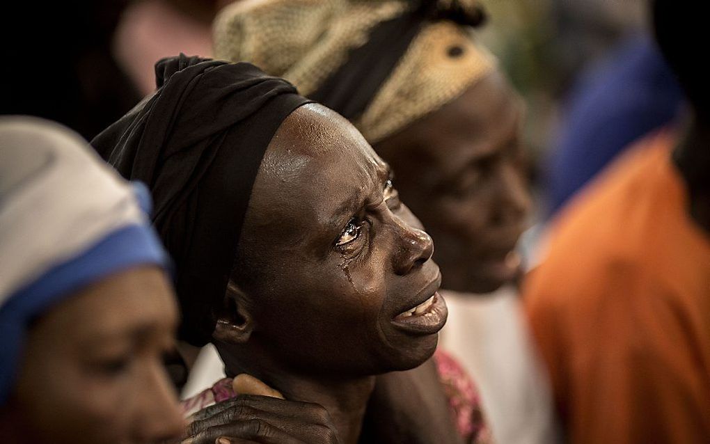 Rouwende vrouwen in Bangui, afgelopen zomer. Beeld AFP