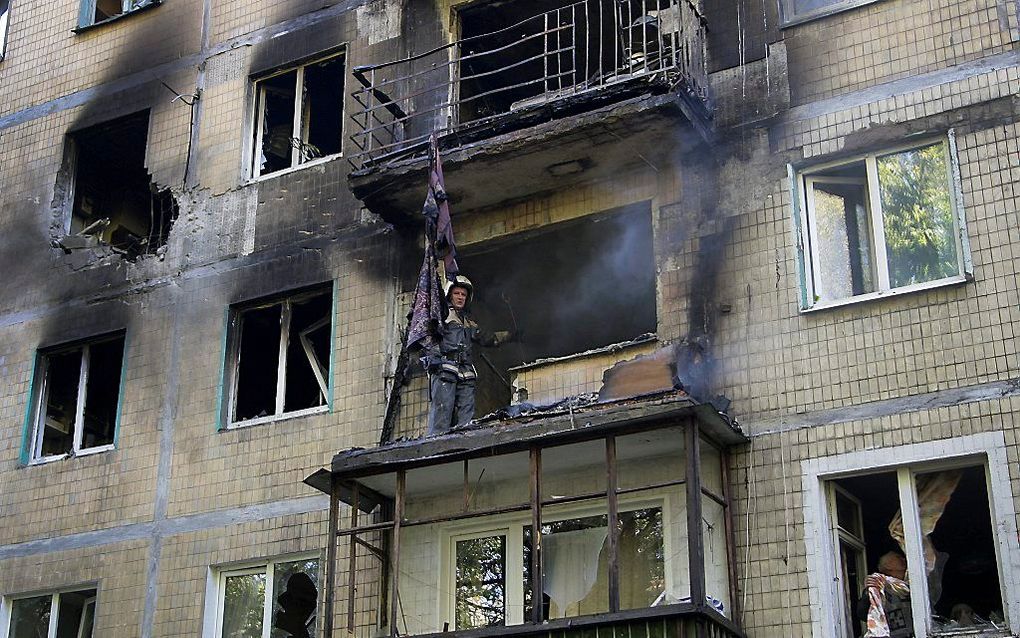 Beschadigd gebouw in Donetsk. Beeld EPA