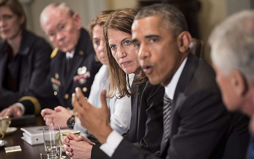 Obama tijdens een beraad over ebola, woensdagavond. Beeld AFP