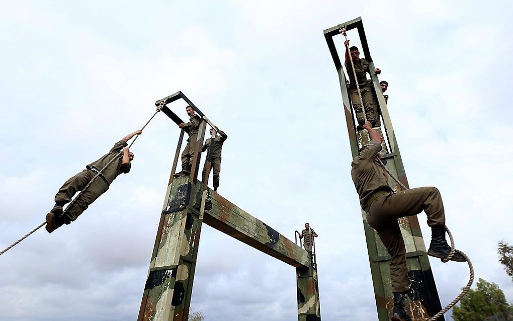 Koerdische Peshmerga's tijdens een training. beeld AFP