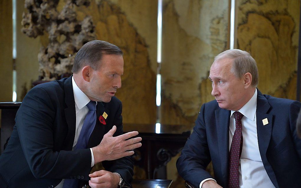 Premier Tony Abbott van Australië heeft van de Russische president Vladimir Poetin excuses en schadevergoeding geëist voor het neerschieten van de Maleisische vlucht MH17.  beeld AFP