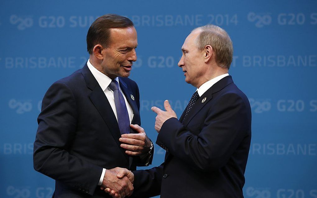 De Russische president Poetin (r.) en de Australische premier Tony Abbott in Brisbane. beeld AFP