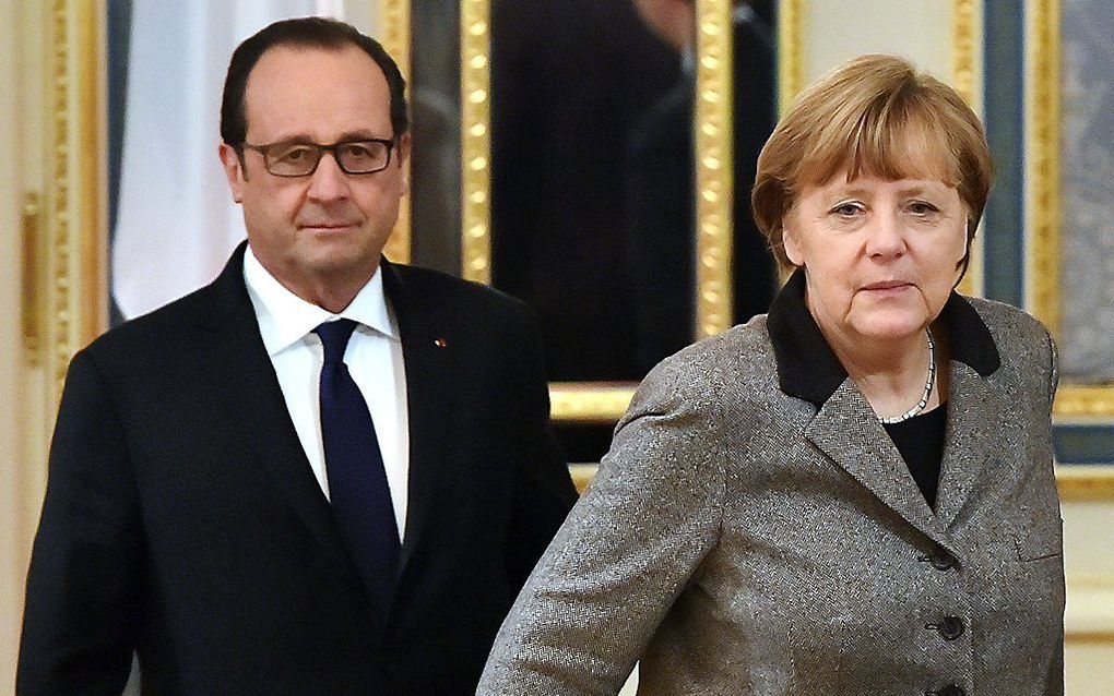 Merkel en Hollande donderdag in Kiev. beeld AFP