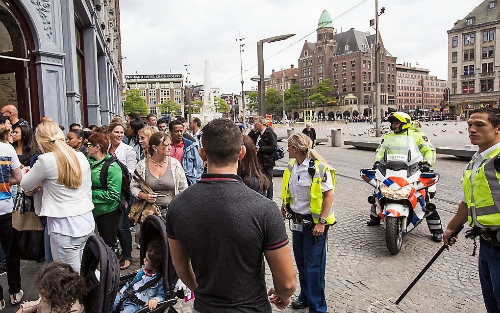 Politie op de Dam in Amsterdam, juni 2014. beeld ANP