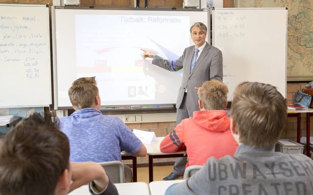 Een les van geschiedenisdocent Peter Speelman op het Driestar College in Gouda.             Beeld Sjaak Verboom