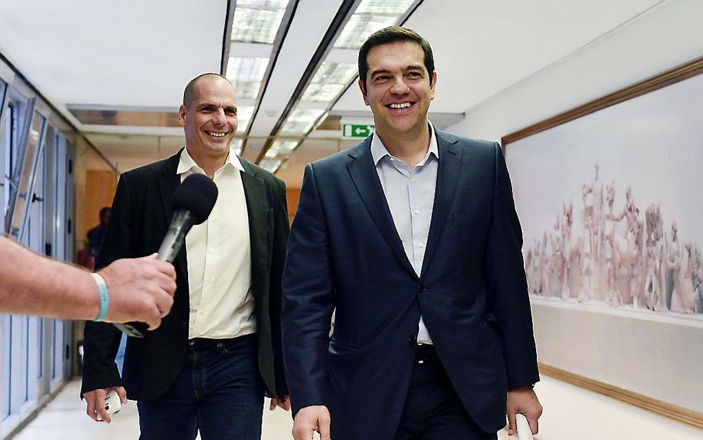 Tsipras en Varoufakis. Beeld AFP