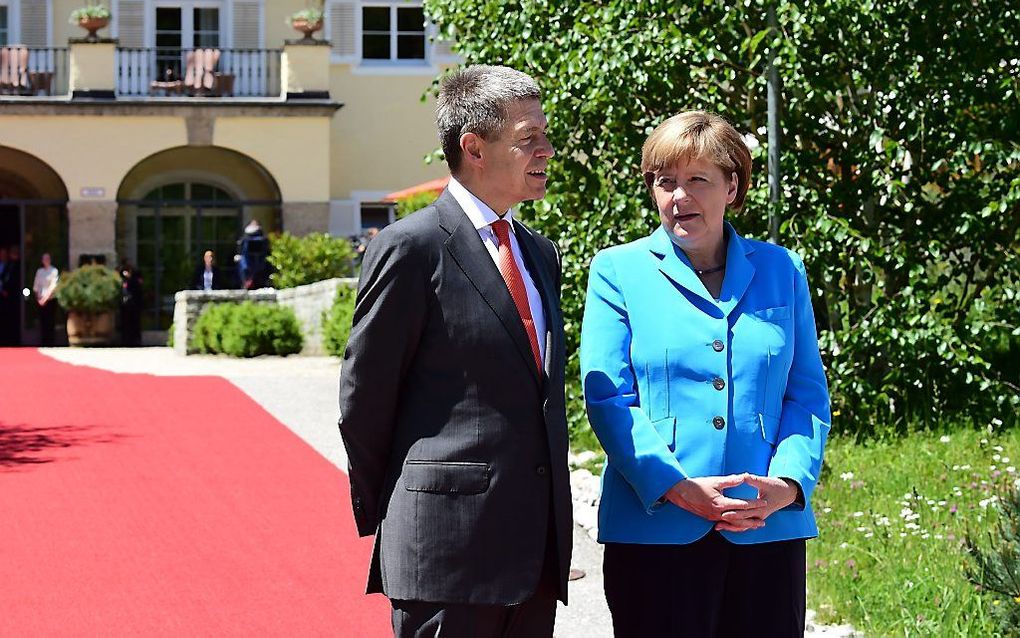 Angela Merkel en haar echtgenoot, Joachim Sauer. beeld AFP