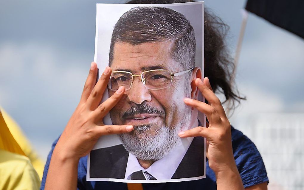 Protest tegen de doodstraf voor Mursi. Beeld AFP