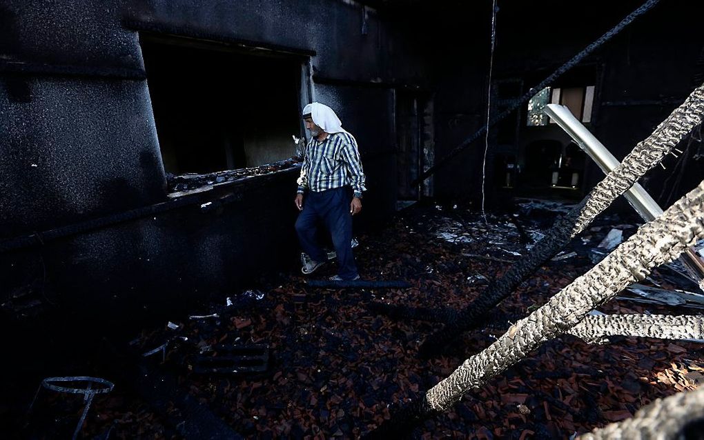 Een anderhalf jaar oude baby is in de Westelijke Jordaanoever om het leven gekomen nadat Israëliërs het huis waarin het kind lag in brand staken. beeld EPA