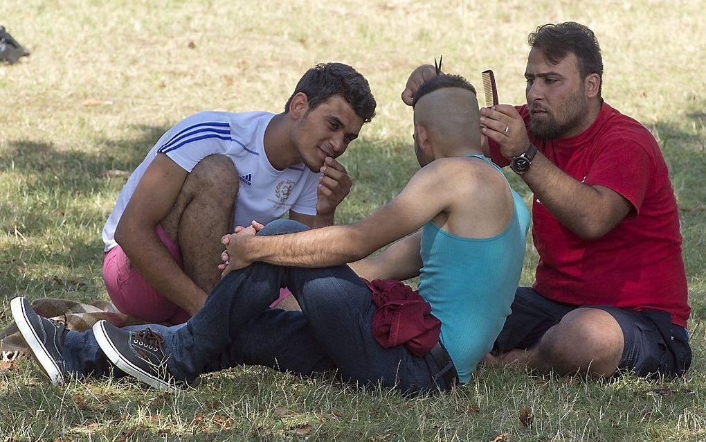 Migranten in het Oostenrijkse Traiskirchen. beeld AFP