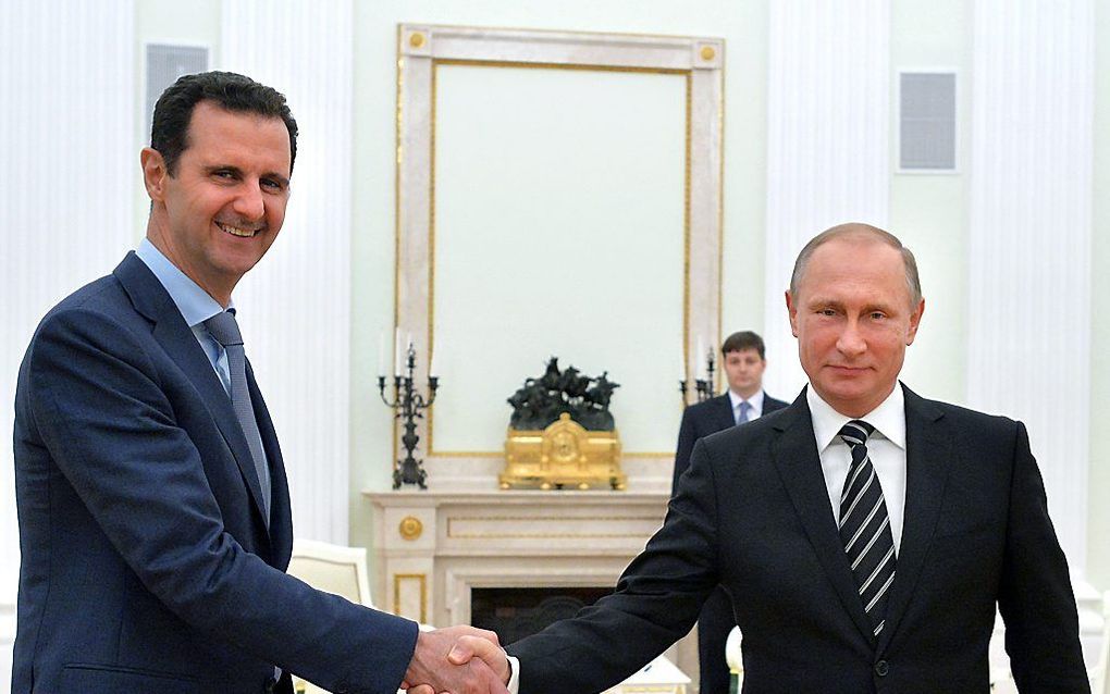 Assad (l.)bij Poetin. beeld EPA