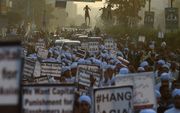 Felle protesten in Pakistan tegen de vrijlating van Asia Bibi, die jarenlang wegens vermeende blasfemie in een Pakistaanse dodencel zat. beeld AFP, Asif Hassan