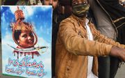 Protesten tegen de vrijlating van Asia Bibi, vrijdag in Pakistan. beeld AFP, Arif Ali