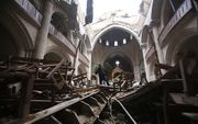 Een verwoeste kerk in Oost-Aleppo. beeld AFP, Youssef Karwashan