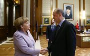 Merkel (l.) en Erdogan. beeld AFP, KAYHAN OZER