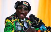 Blijft Mugabe of niet; dat is de vraag. beeld AFP, ZINYANGE AUNTONY