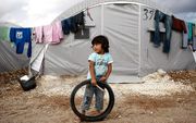 Syrisch meisje in een Turks vluchtelingenkamp. beeld EPA