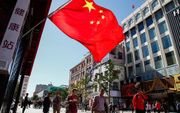 Een ”sociaal kredietsysteem” is volgens de Chinese overheid noodzakelijk voor het „bouwen van een harmonieuze socialistische samenleving”. Foto: winkelstraat in Beijing. beeld EPA, Rolex Dela Pena