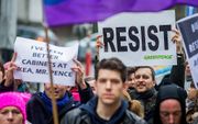 Protest in Brussel tegen de Amerikaanse regering. beeld EPA