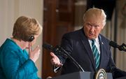 Merkel (l.) en Trump. beeld EPA