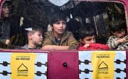 Jonge Syrische vluchtelingen in Athene. beeld AFP