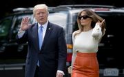 Trump en zijn vrouw kort voor vertrek. beeld EPA