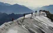 „Een bergbeklimmer kan kiezen welke top hij wil bereiken, maar na de start past de berg zich niet aan zijn wensen aan.” beeld AFP, Patrick Baert