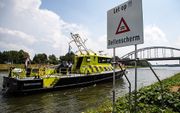 Een bord bij het Amsterdam-Rijnkanaal om het langskomende vaarverkeer te attenderen op een door Rijkswaterstaat aangelegd bellenscherm waarmee de verzilting van het water wordt bestreden. beeld ANP, Alexander Schippers