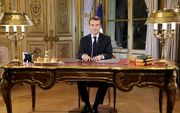 President Emmanuele Macron tijdens zijn toespraak tot de natie. beeld AFP